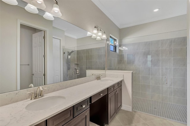 bathroom with tile patterned floors, a shower with shower door, vanity, and crown molding