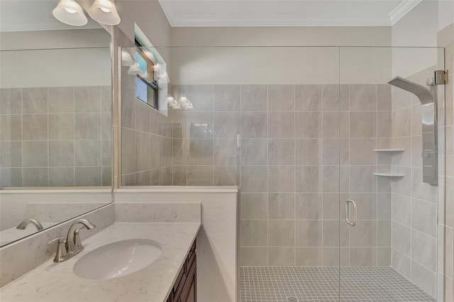 bathroom with ornamental molding, an enclosed shower, and vanity