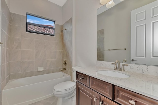 full bathroom with tile patterned floors, tiled shower / bath combo, vanity, and toilet