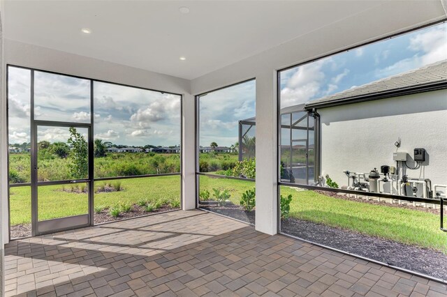 unfurnished sunroom with plenty of natural light