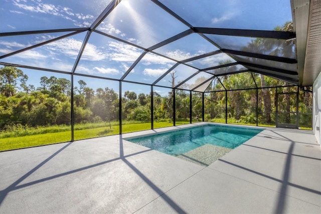 view of swimming pool featuring a lanai and a patio area