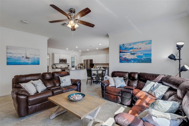 tiled living room featuring ceiling fan and crown molding