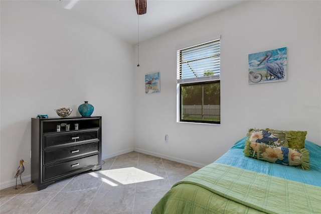 bedroom with light tile patterned flooring and ceiling fan