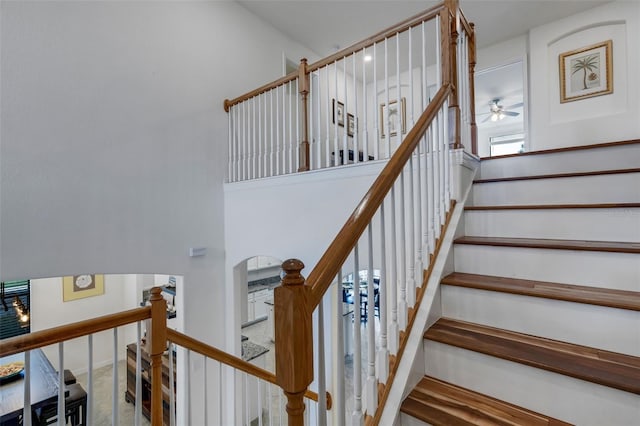 stairway with ceiling fan