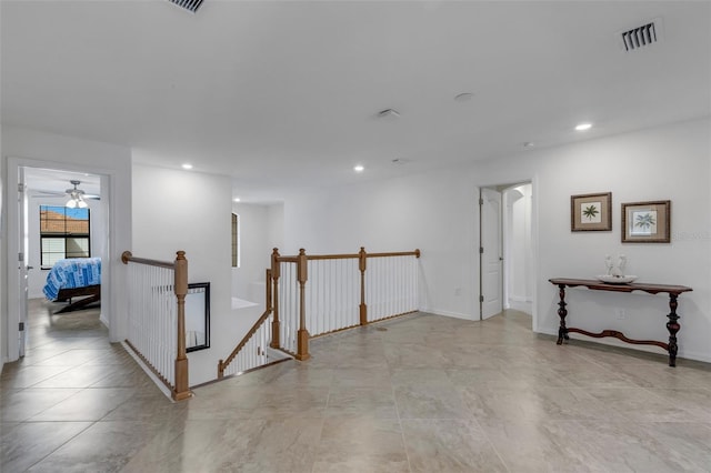 unfurnished room with ceiling fan