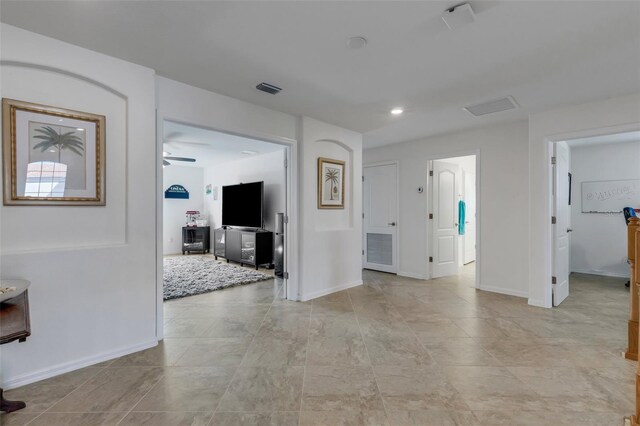 interior space featuring ceiling fan