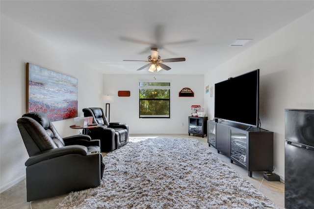 living room with light tile patterned flooring and ceiling fan