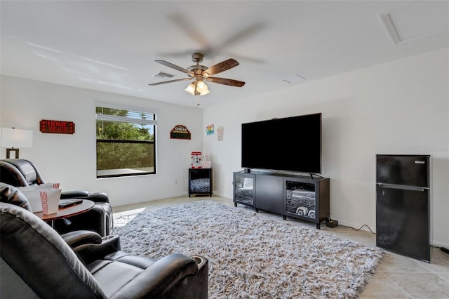 tiled living room with ceiling fan