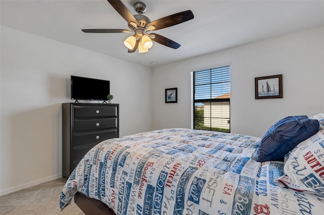 tiled bedroom with ceiling fan