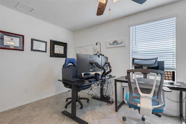 office space with ceiling fan and light tile patterned floors