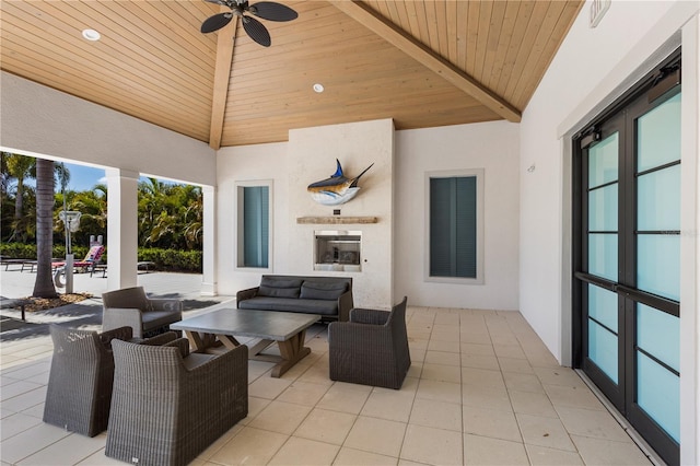 view of patio / terrace with an outdoor living space, ceiling fan, and a gazebo