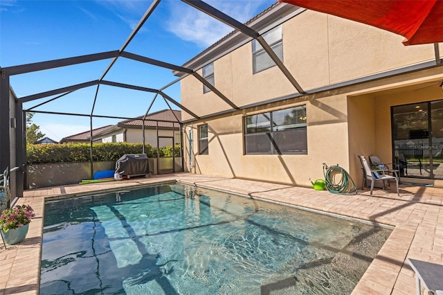 view of pool featuring a lanai and a patio area