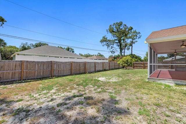 view of yard with ceiling fan