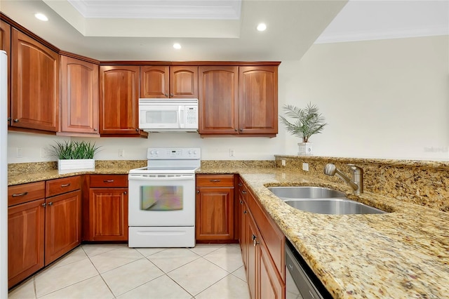 kitchen featuring white appliances, light stone counters, crown molding, and sink