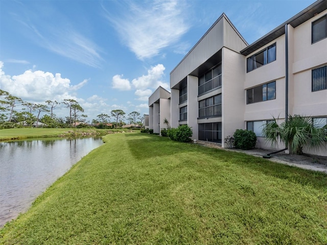 5050 Marianne Key Rd Unit 3B, Punta Gorda, FL 33955 - view of home's community with a lawn and a water view