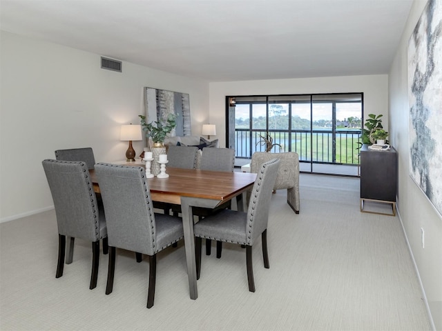 dining area with light colored carpet