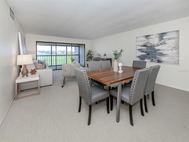 view of carpeted dining area