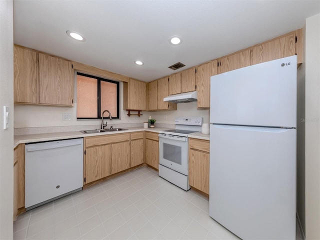 kitchen featuring light brown cabinetry, light tile patterned floors, sink, and white appliances