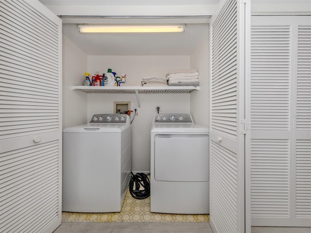 laundry area with independent washer and dryer