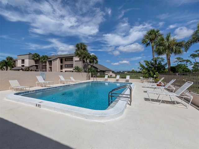 view of swimming pool featuring a patio