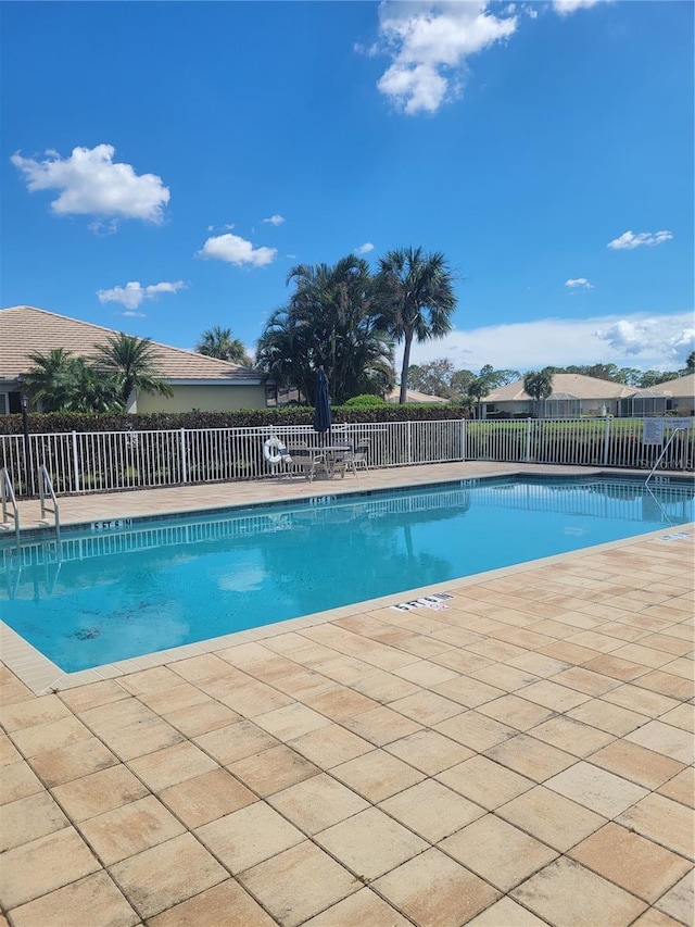 view of swimming pool featuring a patio