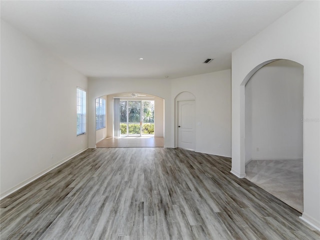 empty room with hardwood / wood-style floors