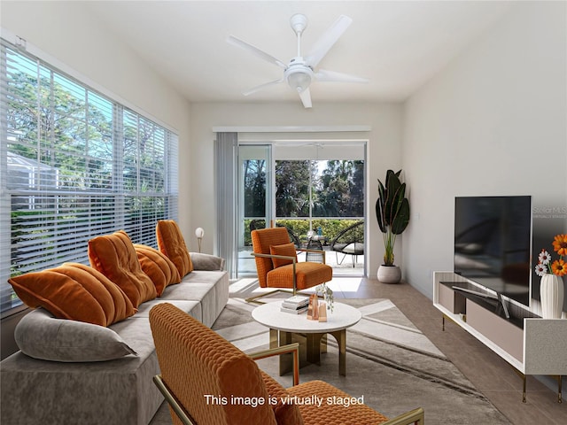 tiled living room featuring ceiling fan