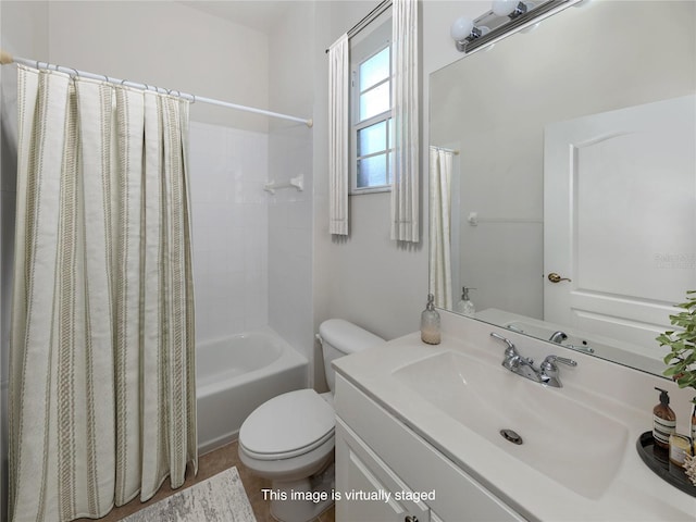 full bathroom featuring toilet, shower / bath combo, and vanity