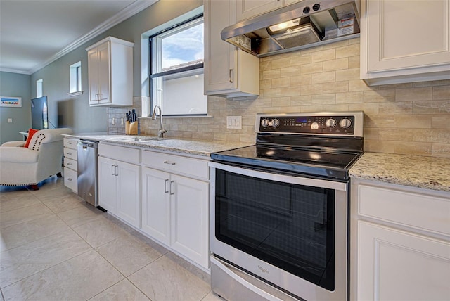 kitchen featuring white cabinets, decorative backsplash, stainless steel appliances, extractor fan, and ornamental molding