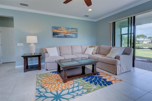 living room featuring ceiling fan, light tile patterned floors, and crown molding