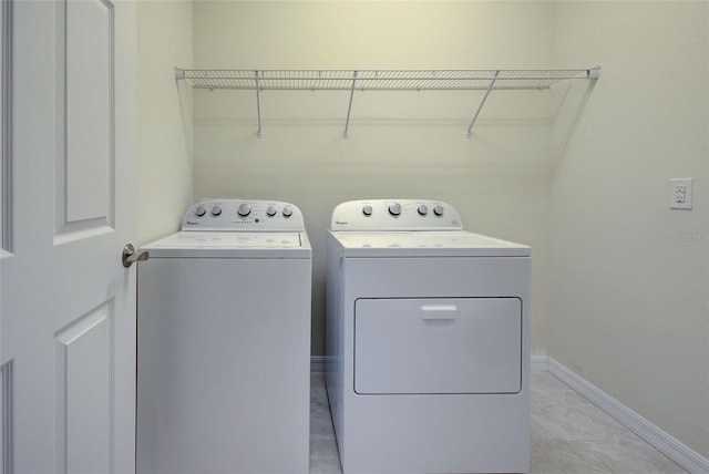 laundry area with independent washer and dryer