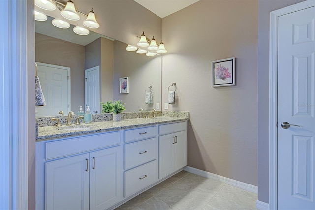 bathroom featuring tile patterned flooring and vanity