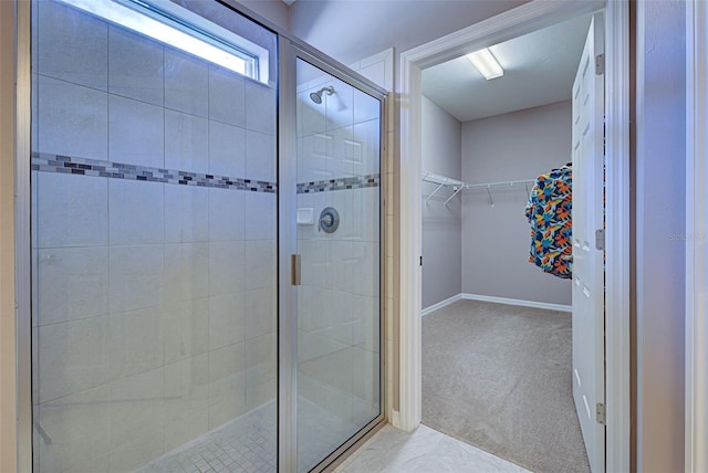 bathroom featuring a shower with shower door