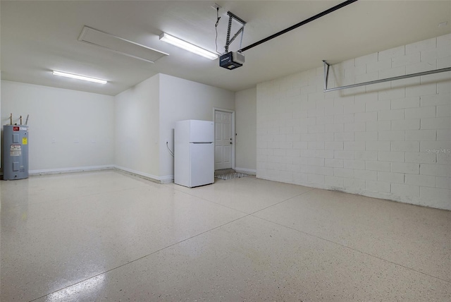 garage with electric water heater, white refrigerator, and a garage door opener