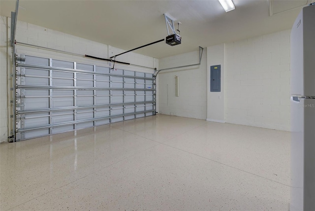 garage with a garage door opener, electric panel, and white refrigerator