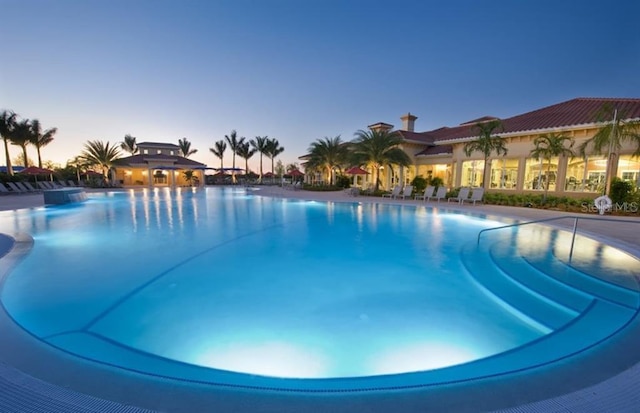 view of pool at dusk