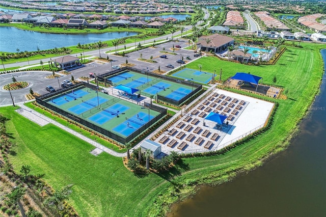 birds eye view of property with a water view