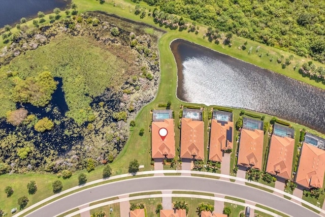 birds eye view of property featuring a water view