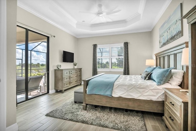 bedroom with access to outside, ornamental molding, light wood-type flooring, and ceiling fan