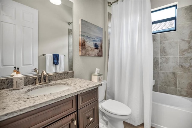 full bathroom featuring vanity, toilet, and shower / tub combo