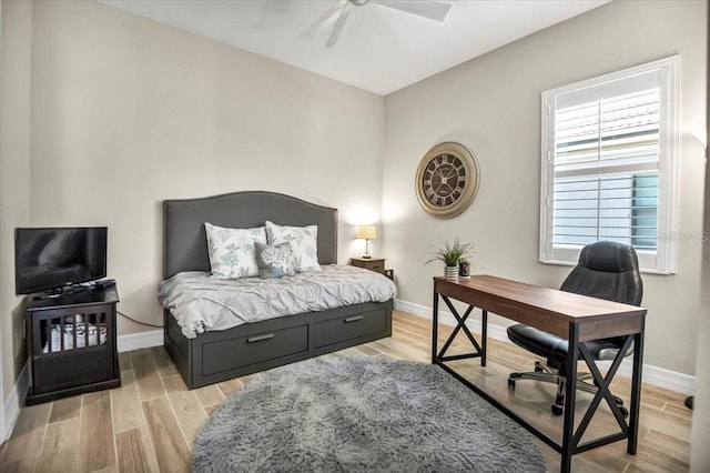 bedroom featuring ceiling fan and light hardwood / wood-style flooring