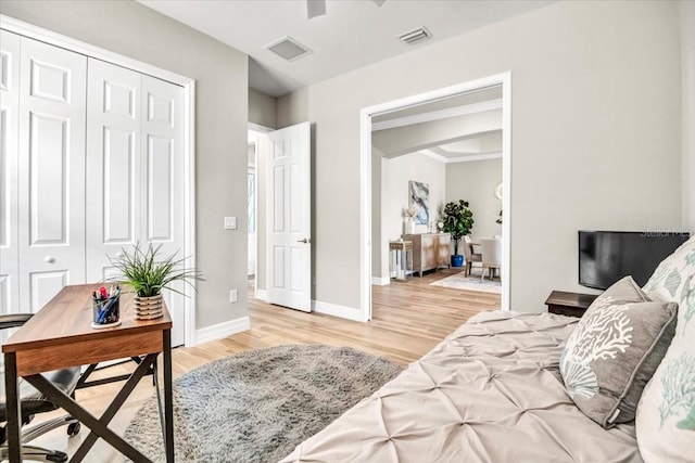 bedroom featuring a closet and light wood-type flooring