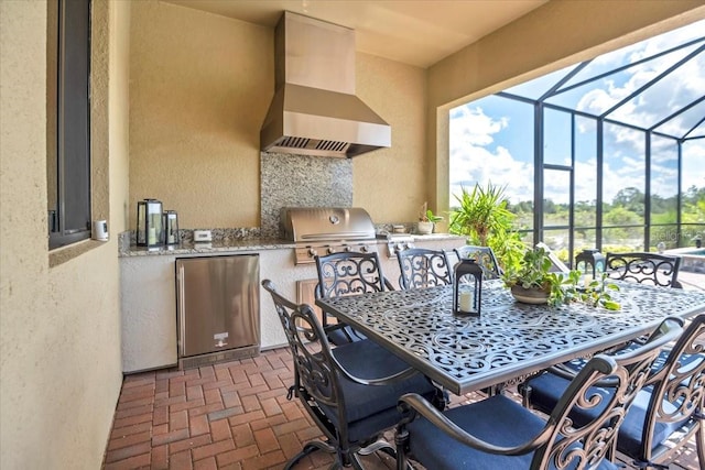 view of patio / terrace featuring area for grilling, a lanai, and a grill