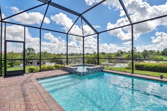 view of pool with an in ground hot tub, a patio, and a lanai