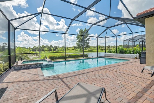 view of swimming pool with an in ground hot tub, a patio area, glass enclosure, and a water view