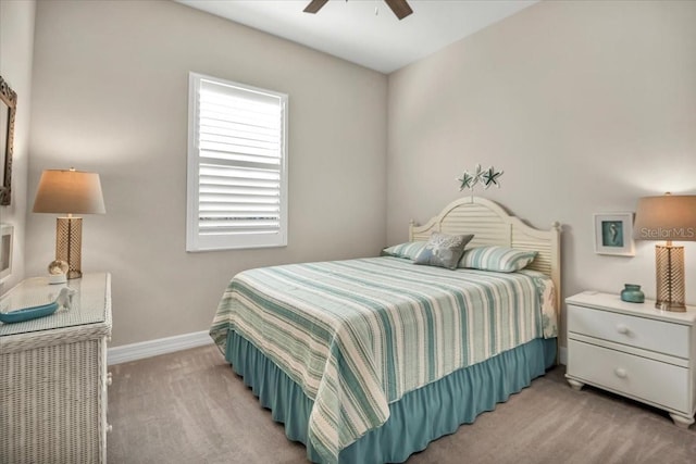 bedroom with light colored carpet and ceiling fan