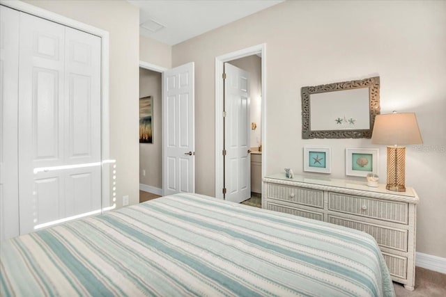 bedroom featuring a closet and carpet floors