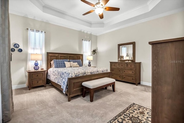 bedroom featuring ceiling fan, crown molding, and a raised ceiling