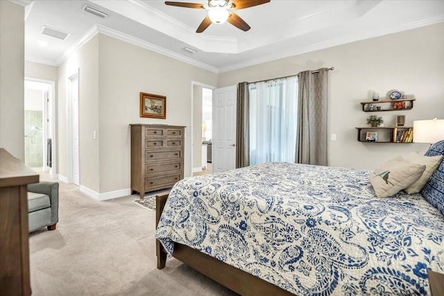 bedroom featuring ornamental molding, light colored carpet, connected bathroom, and ceiling fan