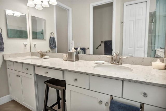 bathroom with vanity and tile patterned flooring